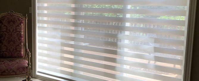 Custom zebra blinds on large windows in a Toronto home by Nifty Blinds, providing privacy and light control.