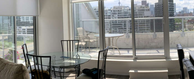 Custom roller blinds in a Toronto condos with large windows